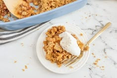 a white plate topped with food next to a blue casserole dish filled with ice cream