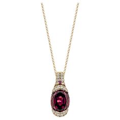 Sunita Nahata showcases an exquisite diamond studded Rubellite pendant that exudes grace and elegance. This exquisite 18 Karat rose gold pendant is ideal for any special occasion because it combines traditional elegance with modern flair. Rhodolite Pendant in 18Karat Rose Gold with White Diamond. Rhodolite: 3.46 carat, 10X8mm size, oval shape. Rhodolite: 0.02 carat, 1.50mm size, round shape. White Diamond: 0.08 carat, 1.30mm size, round shape, G color, VS clarity. White Diamond: 0.04 carat, 1.00 Rose Gold Pendant, Naha, Diamond Studs, White Diamond, Oval Shape, Gold Pendant, Round Shape, Or Rose, Jewelry Necklaces