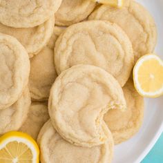 lemon cookies are arranged on a white plate