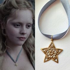 a close up of a person wearing a necklace with a star on it and an image of a woman's face