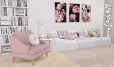 a living room filled with lots of white furniture