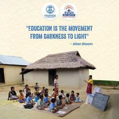 a group of children sitting on the ground in front of a hut with a sign that says education is the movement from darkness to light