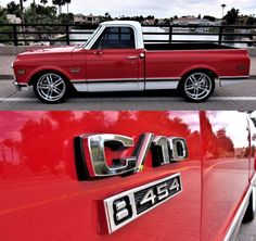 an old red pickup truck parked in a parking lot next to another red pick up truck