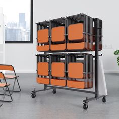 an orange chair sitting next to a black and white rack with lots of orange chairs