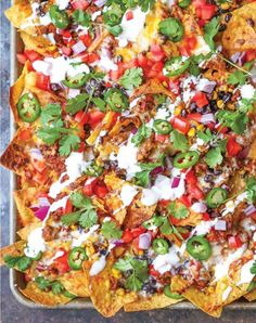 an overhead view of nachos in a pan