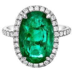 From Emilio Jewelry, a well known and respected wholesaler/dealer located on New York’s iconic Fifth Avenue,  Featuring a spectacular and extremely unique shape elongated cushion cut emerald, with an astonishing ratio. The color is vivid green and gorgeous face up. Please inquire for more images, certificates, and details. Zoom meetings available!  .  Please request to view the appraisal. Appraisals are provided by GAL New York, an independent certified appraiser specializing in high end investm Luxury Emerald Ring With Halo Design, Luxury Cushion Cut Emerald Ring, Cushion Cut Emerald Ring For Formal Occasions, Emilio Jewelry, Golconda Diamond, Elongated Cushion Cut, Green Emerald Ring, Elongated Cushion, Emerald Jewelry