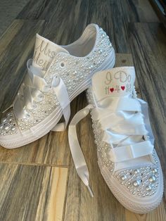 Converse with white pearls and Rhinestones encrusted all over the shoe. !  I can do white pearls or all ivory. (I will do the white unless you ask for something else ) I can also add in some blue rhinestones for your something blue. Or silver rhinestones Please write that in the notes to seller.  I can change the personalization too ! Photo with Mrs Janeau is palest ivory thread  Platform shoes are available in my shop, (search platform) These shoes will sparkle and get noticed across the room! Pearl-embellished Round Toe Wedding Shoes, Pearl Embellished Wedding Shoes With Round Toe, White Embellished Lace-up Sneakers, White Pearl Wedding Shoes For Bridal Shower, Elegant Wedding Sneakers With Rhinestones, Elegant Lace-up Wedding Shoes With Rhinestones, Wedding Lace-up Sneakers With Rhinestones, Elegant White Low-top Wedding Shoes, Wedding White Embellished Sneakers