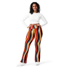 Designed to enhance your figure, these trendy leggings feature a high waist and a butt-lifting cut. The flared leg bottoms add a touch of style and make the leggings comfortable. Wear them on a walk, to the gym, or style them up with a bomber jacket or hoodie. * 74% recycled polyester, 26% elastane * Fabric weight (may vary by 5 7.37 oz./yd.² (250 g/m²) * Soft and stretchy premium quality fabric with a mild compression feel * Moisture-wicking fabric * UPF 50+ protection * High-waisted with a butt-lifting cut * Flared design from the knee down * Double-layered waistband with a pocket on the inside * The fabric is OEKO-TEX 100 standard certified * Blank product components sourced from China and Turkey Disclaimer: If body measurements fall between sizes, size up for a comfortable fit and size High Waist Multicolor Fitted Leggings, Trendy High Waist Multicolor Leggings, Trendy Fitted Yoga Pants, Retro Stretch High-waisted Pants, Trendy High Waist Fitted Yoga Pants, Trendy Fitted High-waist Yoga Pants, Trendy Fall Yoga Bottoms, Retro Stretch Bottoms With Elastic Waistband, Retro Fitted Bottoms With Elastic Waistband