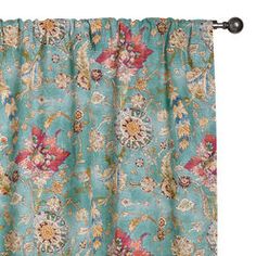 a blue curtain with flowers on it and a black rod handle hanging from the side