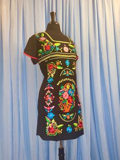 Black Folk Embroidered Summer Dress, Traditional Short Sleeve Dress With Embroidered Border, Black Fitted Embroidered Dress For Festival, Festive Multicolor Geometric Embroidered Dress, Festive Multicolor Geometric Embroidery Dress, Black Cotton Folk Embroidered Dress, Traditional Black Dress With Embroidered Neckline, Traditional Short Sleeve Dress With Multicolor Embroidery, Traditional Black Summer Dress