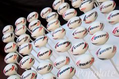 several dozens of white and red tennis balls on a rack