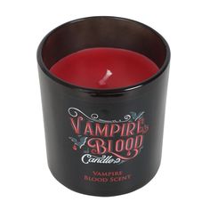 the vampire blood candle is in a black cup