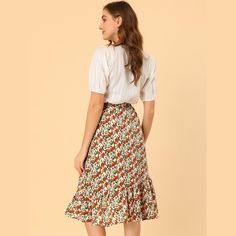 Channel your everlasting love for floral prints with this ultra-classic midi skirt with a ruffle hem, which just adores the detailing for a feminine and fashionable feel. It would be easy to pair it with a simple, light, and plain shirt or blouse. Featuring floral detailing and a midi length, it is the perfect casual piece to be paired with sandals or sneakers for a cute day look. Midi Skirt With Ruffle Hem, Spring Knee-length Skirt With Ruffle Hem, Casual Midi Skirt With Ruffle Hem, Flared Ruffle Skirt For Garden Party, Flared Ruffled Skirt For Garden Party, Ruffled Flared Skirt For Garden Party, Knee-length Ruffled Skirt For Day Out, Feminine Ruffle Hem Skirt For Garden Party, Flowy Knee-length Skirt With Ruffle Hem