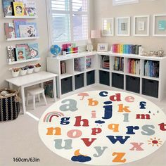 a child's playroom with bookshelves, toys and pictures on the wall