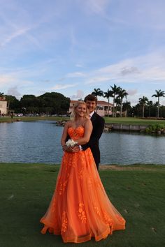 prom, prom picture inspo, orange dress, orange prom dress,orange matching tie, florida, prom in florida, jovani gowns, jovani prom, floral dress, unique prom dress, orange prom, flowy prom dress, palm trees, boyfriend,date,couple,teenagers, highschool, highschool dance, senior prom, junior prom, tall couple, dress inspo, prom inspo, love, in love, highschool sweethearts, lake, prom picture, prom nails, nail inspo, corsage, event nails, dance nails, school dance, aesthetic pic, matching Baddie Prom Dresses, Baddie Prom, Orange Prom Dress, Flowy Prom Dresses, Jovani Gown, Orange Prom Dresses, Prom Picture Poses, Prom Pics