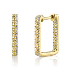 From Shy Creation, these beautiful rectangle hoop earrings will add a dazzling measure of glamour to any ensemble, sure to become a cherished staple accessory of your jewelry collection. Comprised of gleaming 14k yellow gold, these lovely earrings exhibit 124 twinkling round diamonds set along the hoops. The diamonds total 1/4ctw and are H in color and SI in clarity. Each earring measures 0.45 inch in width and 0.6 inch in height. The metal weight is 2.5 grams. Rectangular Yellow Gold Earrings With Diamond Accents, Fine Jewelry Rectangular Earrings With Diamond Accents, Rectangular Earrings With Diamond Accents, Rectangular Cubic Zirconia Diamond Earrings, Classic Rectangular Earrings With Diamond Accents, Yellow Gold Diamond Rectangular Earrings, Luxury Rectangular Cubic Zirconia Diamond Earrings, Rectangular Diamond Earrings Fine Jewelry, Luxury Rectangular Diamond Earrings With Accents