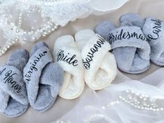 several pairs of slippers that say bridesmaid and i have always been married