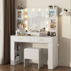 a white vanity with lights on it in a room