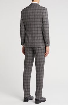 Sophisticated peaked lapels smarten the jacket of this trim-fit suit paired with flat-front trousers and finished in a handsome plaid print. 36" inseam; 10 1/2" rise (size 40R) Jacket has peaked lapels; chest welt pocket; front flap pockets Lined 81% polyester, 17% rayon, 2% spandex Dry clean Imported Trim Fit, Concert Looks, Peak Lapel, Fall Kids, Sweaters And Leggings, Fitted Suit, Kids Boots, Plaid Print