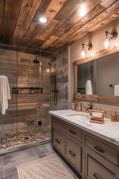 a bathroom with wooden walls and tile flooring, along with a walk in shower