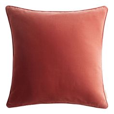 a red pillow on a white background