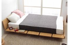 the bed is made up and ready for someone to use it in their home or office