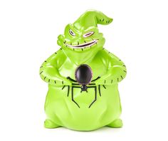 a green toy with a spider on it's chest