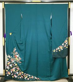 This furisode (long-sleeved kimono) has cherry blossoms, chrysanthemums, and plum blossoms on a dark green background. The peonies on the front are embroidered. The simple pattern changes the atmosphere depending on the obi and accessories, so you can coordinate it to your own taste in a wide range of ways, such as a simple one-tone coordination or a trendy lace coordination. Length from sleeve to sleeve: 68 cm Length (from the shoulder): 168 cm Sleeve width: 34 cm Sleeve length: 114.5 cm Front width: 24.5 cm Back width: 30cm Stitching on body side: 1.5cm Sleeve side: 1.5cm Inner fly width: 6cm Material: Pure Silk Condition:Please see photos. Thank you for visiting my page. My store owns a lot of unique items that you won't see in other stores. You won't regret it! ☆ Furisode" symbolizes y Plum Blossoms, Long Sleeve Kimono, Dark Green Background, Luxurious Wedding, Flower Green, Japanese Patterns, Peony Flower, Japanese Kimono, Unique Items