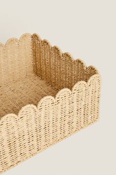 a wicker basket with scalloped edges