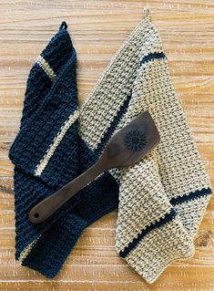 a crocheted dish cloth with a wooden spatula on the side next to it