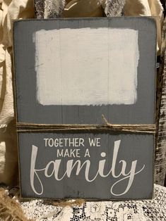 a sign that says together we make a family