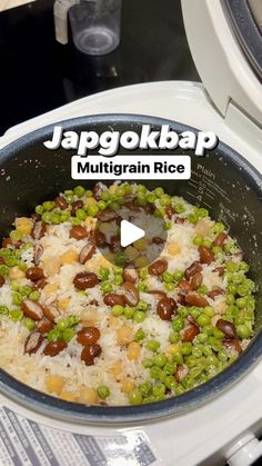 a bowl filled with rice and beans on top of a stove