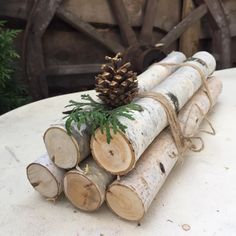 several pieces of wood are stacked on top of each other with a pine cone in the center