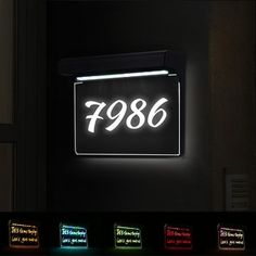 an illuminated sign with the word'786'on it in multiple different colors