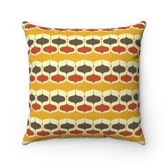 an orange and brown pillow with circles on it