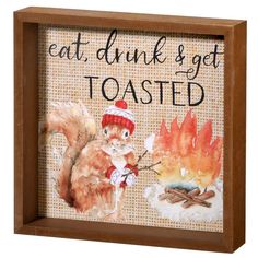 a wooden frame with an image of a squirrel roasting marshmallows and the words eat, drink & get toasted