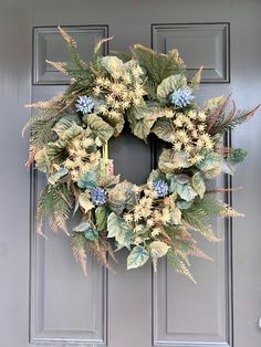 a wreath is hanging on the front door