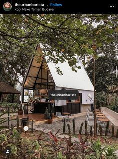 a small house with a roof that is made out of metal and has an open patio area