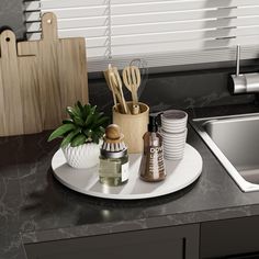 a kitchen counter with utensils and other items on the tray next to the sink