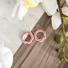 These beautiful handmade flower earrings are crafted from polymer clay with hypoallergenic sterling silver earring hoops, and finished with a pink ceramic-effect resin glaze. They make a lovely gift for the earring fan in your life. If you would like these earrings made in a different colour please feel free to contact me and I will do my best to source or mix the perfect shade for you. This polymer clay jewellery is handmade and therefore there may be slight variations or minor imperfections in each unique piece. Colours may vary slightly compared with the photographs. To care for your handmade jewellery please keep away from moisture and avoid contact with cosmetics such as make up, creams and perfumes. Clean very gently with a damp sponge. Thank you very much for looking at my Etsy shop Pink Sterling Silver Hypoallergenic Hoop Earrings, Pink Hypoallergenic Sterling Silver Hoop Earrings, Pink Flower-shaped Hoop Earrings For Gift, Pink Flower Shaped Hoop Earrings For Gift, Pink Flower-shaped Polymer Clay Earrings, Pink Flower Shaped Hoop Earrings As Gift, Handmade Pink Minimalist Hoop Earrings, Pink Flower Shaped Polymer Clay Earrings, Minimalist Handmade Pink Hoop Earrings