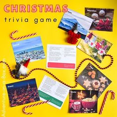 a christmas trivia game with pictures and candy canes on the table next to it