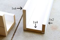 two pieces of cardboard sitting on the ground next to each other with measurements for them