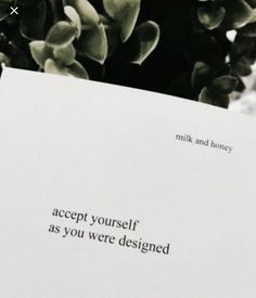 a close up of a piece of paper with writing on it that says accept yourself as you were designed