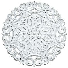 an ornate white plate with flowers on it