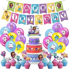 a birthday cake surrounded by balloons and cupcakes