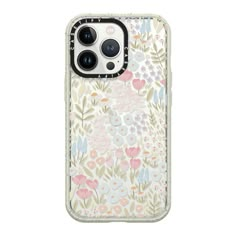 an iphone case with flowers and dots on the front, in pastel pinks