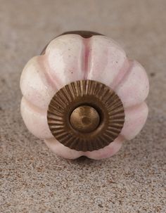 a close up of a doorknob on the floor