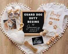 a heart shaped frame with baby's first year pictures and personalized onesuits