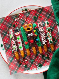 christmas treats made to look like reindeers on a plate with green and red decorations