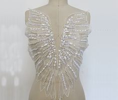 Luxurious Rhinestone Appliquéd Beaded Big Wing Applique Patch, Wedding Bridal Dress Bright Diamond Applique Formal Dress Accessories ★Style No. LC2242 ★measurement  48*17cm ★material Polyester, rhinestone,bead ★Price: The price is for 1 pair. ★ color: picture show ★Use for dress,clothing and some others ★ About the Shipping  The listing is default standard shipping ,which we use China post , as usual , the China post will use 1-4 weeks according to different place.The delivery time  is affected Embellished Fitted White Wedding Dress, White Beaded Wedding Dress For Party, Formal Dress Accessories, Applique Clothes, Bodice Wedding Dress, Wedding Bridal Dress, Wedding Dresses With Flowers, Applique Wedding, Applique Wedding Dress